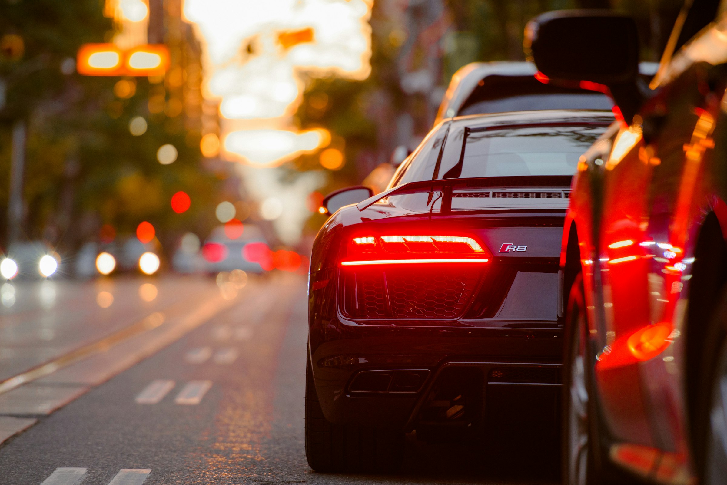 A custom build at dusk, taillights glowing